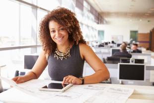 Image of woman in office with tablet